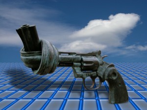 Concept image of a gun with the barrel tied in a knot against the backdrop of a grid.
